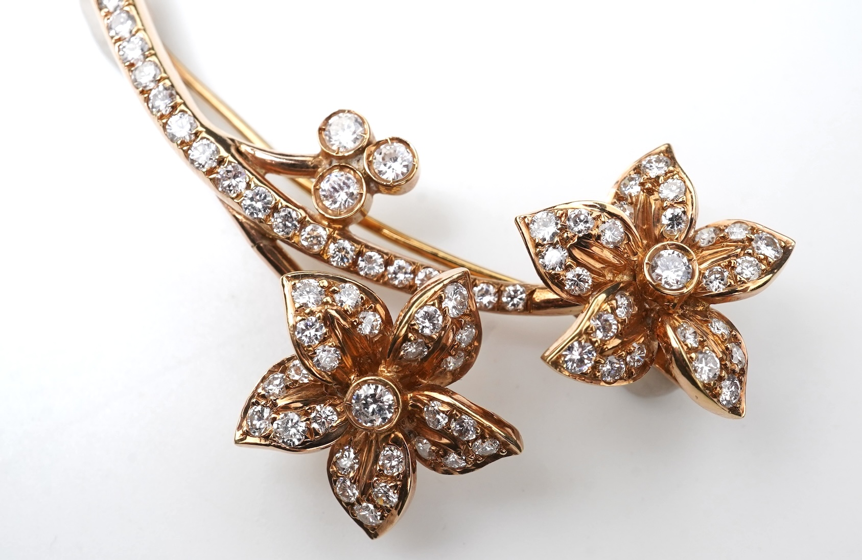 A gold and diamond brooch